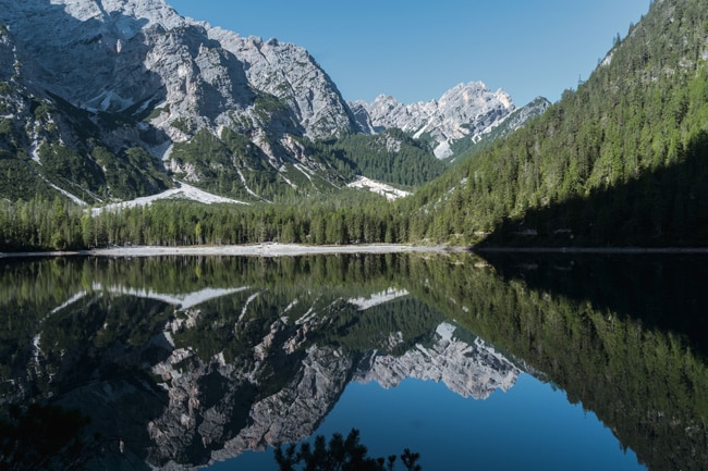 This is a photo of  the hiking trails Around Pragser Wildsee/ Lago di Braies with perfect reflection of the mountain and trees