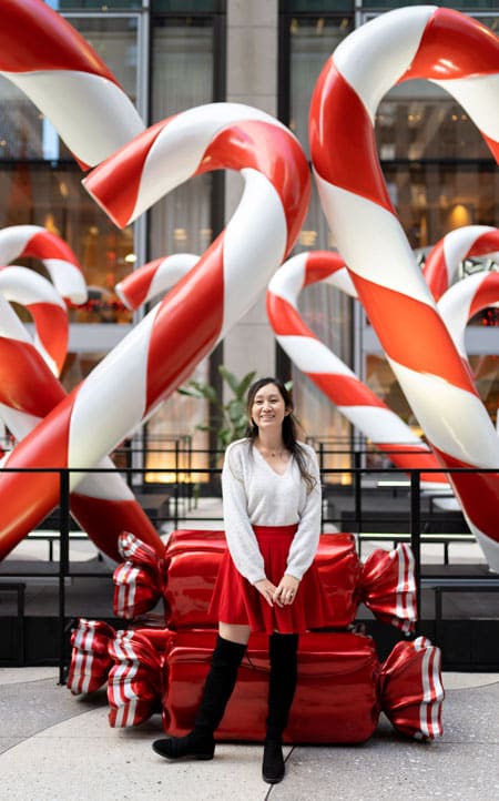 Candy cane holiday decoration in NYC near Radio City on 6th Avenue in the Winter | Best Christmas decorations in New York City in the winter