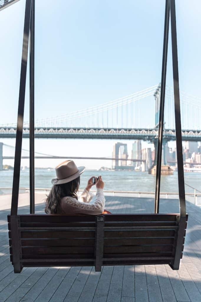 Best photo spots in New York City | Swings overlooking the Manhattan Bridge at Pier 35 